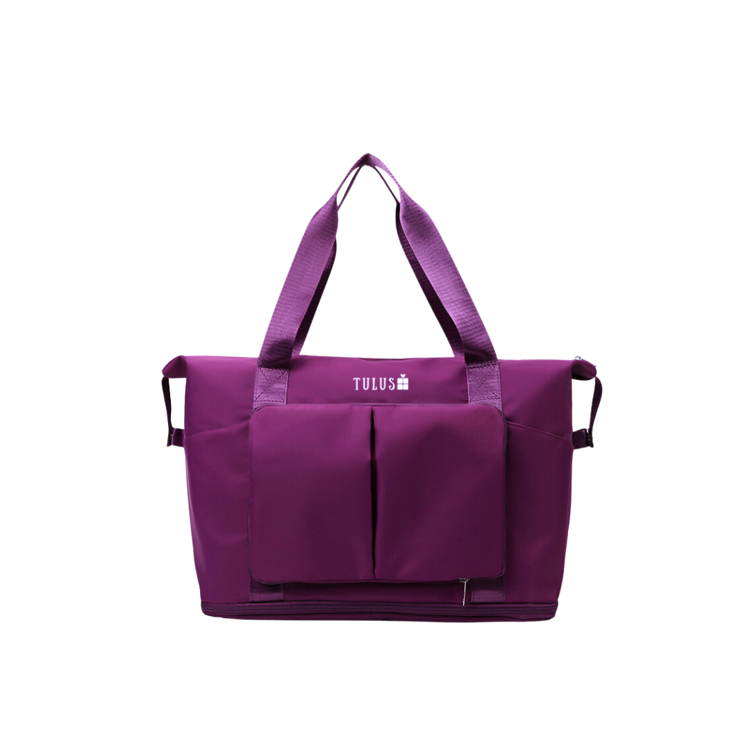 Foldable, expandable and waterproof tote and travel bag in deep purple, spacious, accessible pockets with wet and dry compartments.